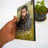 قاب عکس شهید ابراهیم هادی روی تخته شاسی